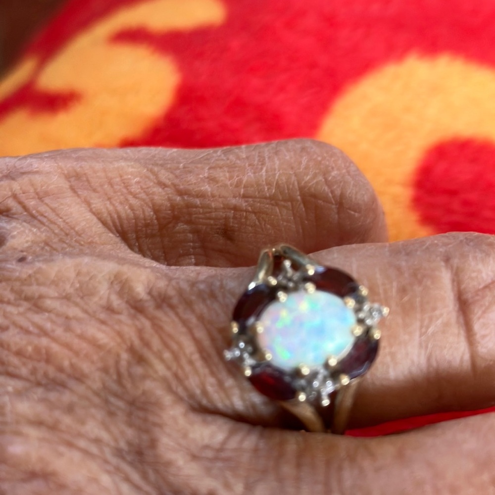 Elegant Gold and Red Opal Ring